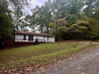 Nestled in the sought-after Diamondhead community, this on Diamondhead Golf and Country Club in Arkansas - for sale on GolfHomes.com, golf home, golf lot