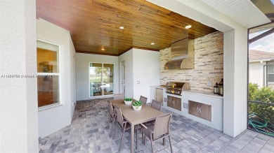 This stunning home boasts panoramic views of the lake and golf on Panther Run Golf Club in Florida - for sale on GolfHomes.com, golf home, golf lot