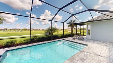 This stunning home boasts panoramic views of the lake and golf on Panther Run Golf Club in Florida - for sale on GolfHomes.com, golf home, golf lot