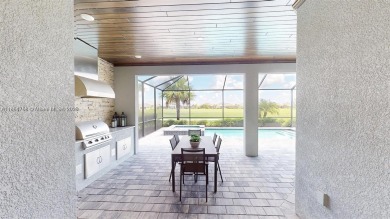 This stunning home boasts panoramic views of the lake and golf on Panther Run Golf Club in Florida - for sale on GolfHomes.com, golf home, golf lot
