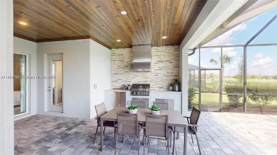 This stunning home boasts panoramic views of the lake and golf on Panther Run Golf Club in Florida - for sale on GolfHomes.com, golf home, golf lot