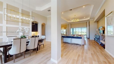 This stunning home boasts panoramic views of the lake and golf on Panther Run Golf Club in Florida - for sale on GolfHomes.com, golf home, golf lot