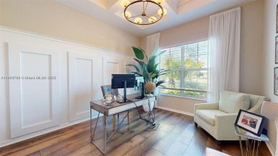 This stunning home boasts panoramic views of the lake and golf on Panther Run Golf Club in Florida - for sale on GolfHomes.com, golf home, golf lot