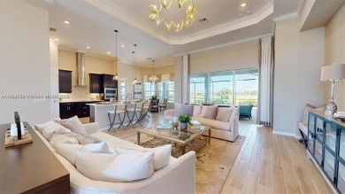 This stunning home boasts panoramic views of the lake and golf on Panther Run Golf Club in Florida - for sale on GolfHomes.com, golf home, golf lot