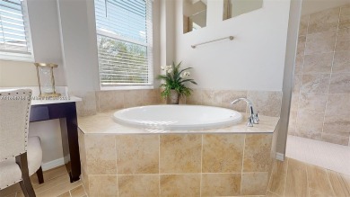 This stunning home boasts panoramic views of the lake and golf on Panther Run Golf Club in Florida - for sale on GolfHomes.com, golf home, golf lot