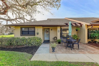 Welcome to 3454 Niblick Court, a beautifully maintained end-unit on Seven Springs Golf and Country Club in Florida - for sale on GolfHomes.com, golf home, golf lot