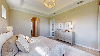 This stunning home boasts panoramic views of the lake and golf on Panther Run Golf Club in Florida - for sale on GolfHomes.com, golf home, golf lot