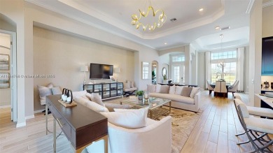 This stunning home boasts panoramic views of the lake and golf on Panther Run Golf Club in Florida - for sale on GolfHomes.com, golf home, golf lot