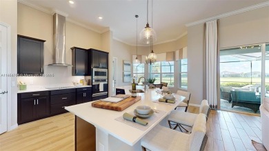 This stunning home boasts panoramic views of the lake and golf on Panther Run Golf Club in Florida - for sale on GolfHomes.com, golf home, golf lot