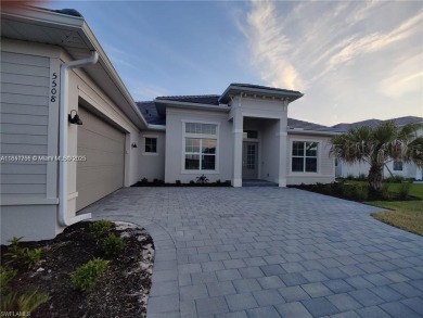 This stunning home boasts panoramic views of the lake and golf on Panther Run Golf Club in Florida - for sale on GolfHomes.com, golf home, golf lot