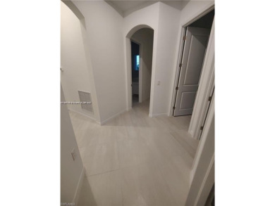 This stunning home boasts panoramic views of the lake and golf on Panther Run Golf Club in Florida - for sale on GolfHomes.com, golf home, golf lot