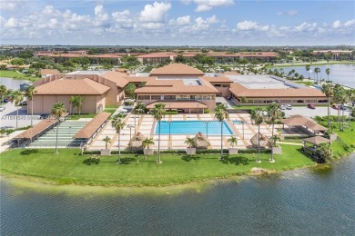 The largest 2-bed, 2-bath corner apartment in the building on Flamingo Lakes Country Club in Florida - for sale on GolfHomes.com, golf home, golf lot