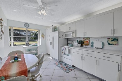 This spacious 3/2 condo in Cypress at Woodmont, offering 1,792 on Woodmont Country Club in Florida - for sale on GolfHomes.com, golf home, golf lot
