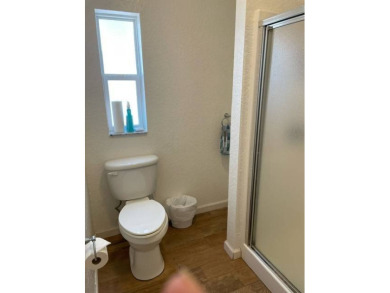Nestled on a somewhat private lot in the 55+ Class A gated RV on Deer Creek RV Golf Resort in Florida - for sale on GolfHomes.com, golf home, golf lot