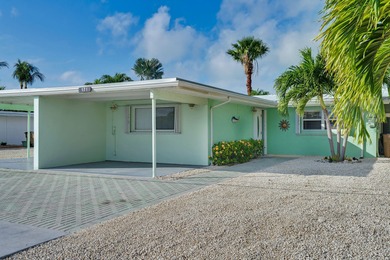 Experience the best of Keys living in this immaculate 2-bedroom on Key Colony Beach Golf Course in Florida - for sale on GolfHomes.com, golf home, golf lot