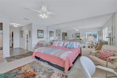 This spacious 3/2 condo in Cypress at Woodmont, offering 1,792 on Woodmont Country Club in Florida - for sale on GolfHomes.com, golf home, golf lot