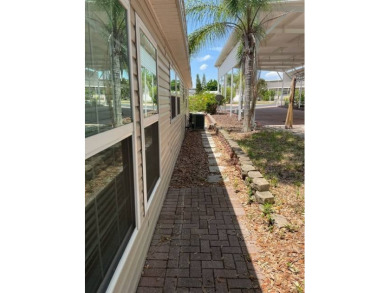 Nestled on a somewhat private lot in the 55+ Class A gated RV on Deer Creek RV Golf Resort in Florida - for sale on GolfHomes.com, golf home, golf lot