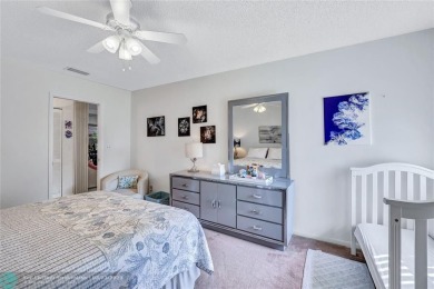 This spacious 3/2 condo in Cypress at Woodmont, offering 1,792 on Woodmont Country Club in Florida - for sale on GolfHomes.com, golf home, golf lot