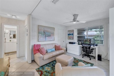 This spacious 3/2 condo in Cypress at Woodmont, offering 1,792 on Woodmont Country Club in Florida - for sale on GolfHomes.com, golf home, golf lot