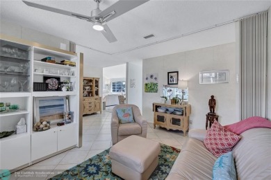 This spacious 3/2 condo in Cypress at Woodmont, offering 1,792 on Woodmont Country Club in Florida - for sale on GolfHomes.com, golf home, golf lot