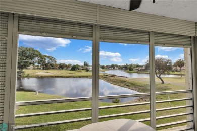 This spacious 3/2 condo in Cypress at Woodmont, offering 1,792 on Woodmont Country Club in Florida - for sale on GolfHomes.com, golf home, golf lot