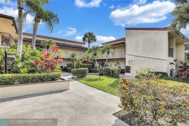 This spacious 3/2 condo in Cypress at Woodmont, offering 1,792 on Woodmont Country Club in Florida - for sale on GolfHomes.com, golf home, golf lot