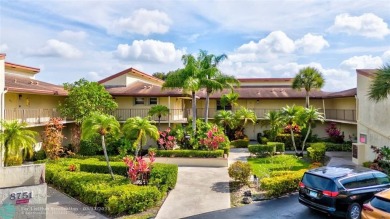 This spacious 3/2 condo in Cypress at Woodmont, offering 1,792 on Woodmont Country Club in Florida - for sale on GolfHomes.com, golf home, golf lot