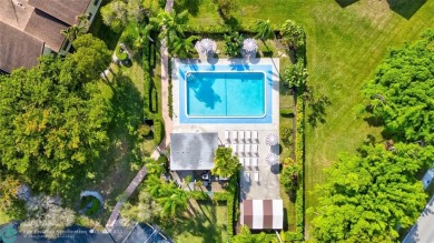 This spacious 3/2 condo in Cypress at Woodmont, offering 1,792 on Woodmont Country Club in Florida - for sale on GolfHomes.com, golf home, golf lot