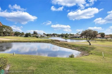 This spacious 3/2 condo in Cypress at Woodmont, offering 1,792 on Woodmont Country Club in Florida - for sale on GolfHomes.com, golf home, golf lot