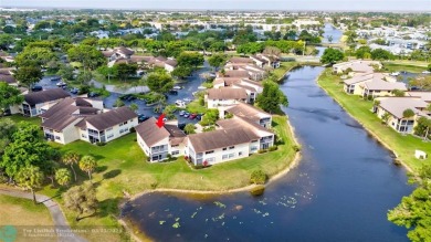 This spacious 3/2 condo in Cypress at Woodmont, offering 1,792 on Woodmont Country Club in Florida - for sale on GolfHomes.com, golf home, golf lot