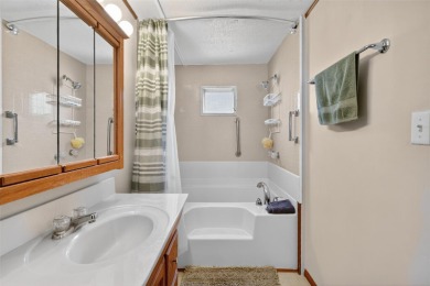 THIS CHARMING 2-bedroom, 2-bath mobile home is nestled in the on Bay Tree Golf Course in Florida - for sale on GolfHomes.com, golf home, golf lot