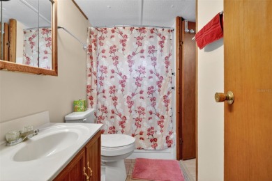 THIS CHARMING 2-bedroom, 2-bath mobile home is nestled in the on Bay Tree Golf Course in Florida - for sale on GolfHomes.com, golf home, golf lot