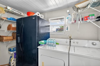 THIS CHARMING 2-bedroom, 2-bath mobile home is nestled in the on Bay Tree Golf Course in Florida - for sale on GolfHomes.com, golf home, golf lot