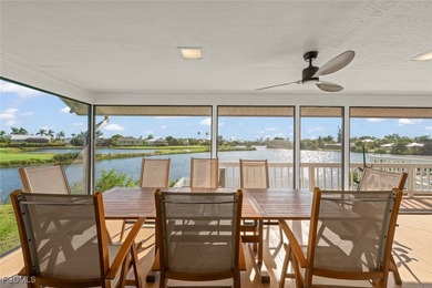 Panoramic lake and golf course views from this elegant island on The Dunes Golf and Tennis Club in Florida - for sale on GolfHomes.com, golf home, golf lot