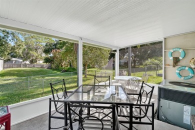 THIS CHARMING 2-bedroom, 2-bath mobile home is nestled in the on Bay Tree Golf Course in Florida - for sale on GolfHomes.com, golf home, golf lot