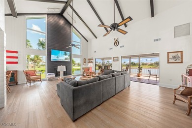 Panoramic lake and golf course views from this elegant island on The Dunes Golf and Tennis Club in Florida - for sale on GolfHomes.com, golf home, golf lot