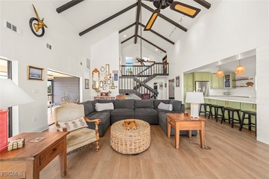 Panoramic lake and golf course views from this elegant island on The Dunes Golf and Tennis Club in Florida - for sale on GolfHomes.com, golf home, golf lot