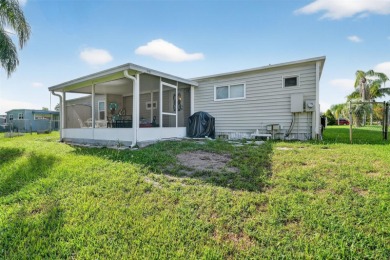 THIS CHARMING 2-bedroom, 2-bath mobile home is nestled in the on Bay Tree Golf Course in Florida - for sale on GolfHomes.com, golf home, golf lot