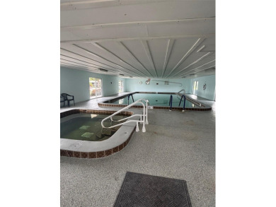 THIS CHARMING 2-bedroom, 2-bath mobile home is nestled in the on Bay Tree Golf Course in Florida - for sale on GolfHomes.com, golf home, golf lot