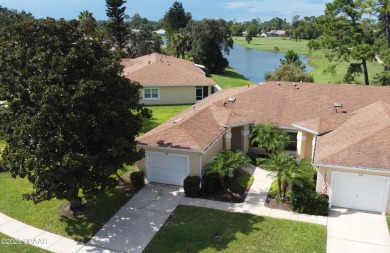 Golf Villa with an amazing golf and water view! This bright and on Turnbull Bay Golf Club in Florida - for sale on GolfHomes.com, golf home, golf lot