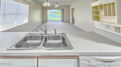 Golf Villa with an amazing golf and water view! This bright and on Turnbull Bay Golf Club in Florida - for sale on GolfHomes.com, golf home, golf lot