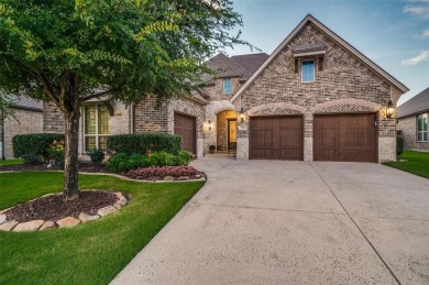 Charming curb appeal and a beautifully detailed brick and stone on The Tribute At the Colony in Texas - for sale on GolfHomes.com, golf home, golf lot