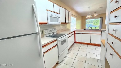 Golf Villa with an amazing golf and water view! This bright and on Turnbull Bay Golf Club in Florida - for sale on GolfHomes.com, golf home, golf lot