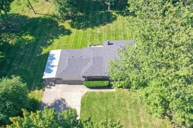 Take a look at this beautiful setting, it's only had one owner on IMA Brookwood Golf Course in Michigan - for sale on GolfHomes.com, golf home, golf lot