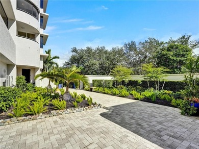 NEW PRICE!! Fabulous first floor end unit-with-a-view in the on Club at Pelican Bay Golf Course in Florida - for sale on GolfHomes.com, golf home, golf lot