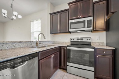 Live the Florida dream in this move‑in‑ready 3BR/2 on LPGA International Golf Course in Florida - for sale on GolfHomes.com, golf home, golf lot