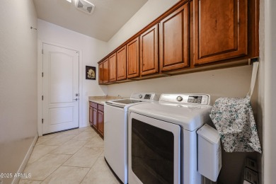 Welcome to this stunning energy-efficient 4-bedroom, 2.5-bath on Estrella Mountain Ranch Golf Course in Arizona - for sale on GolfHomes.com, golf home, golf lot