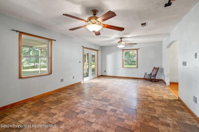 There's room for all the family with this 4 bedroom/2 bathroom on Brooksville Country Club At Majestic Oaks in Florida - for sale on GolfHomes.com, golf home, golf lot