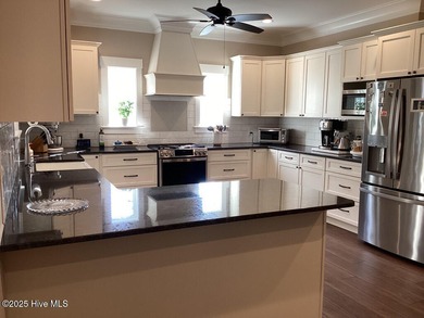 Contemporary tidal home built in 2020. Move-in-ready! Only home on Cypress Landing Golf Club in North Carolina - for sale on GolfHomes.com, golf home, golf lot