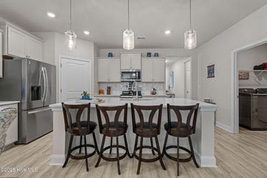 Experience Coastal Living at Its Best in Brunswick Plantation! on Brunswick Plantation and Golf Resorts in North Carolina - for sale on GolfHomes.com, golf home, golf lot